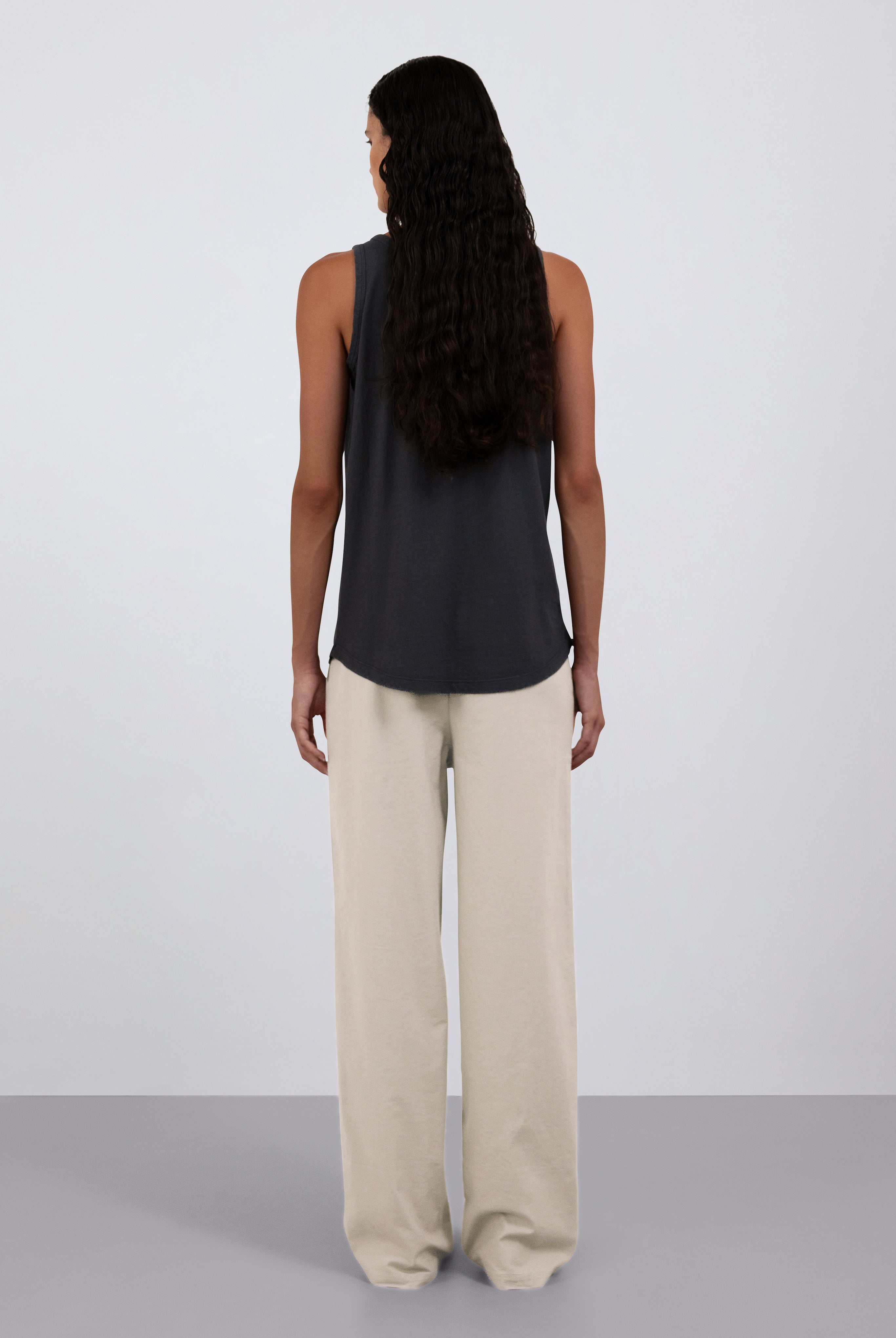 Back view. Shown on model. The Selene in Pitch Black. The Alex in Beige.