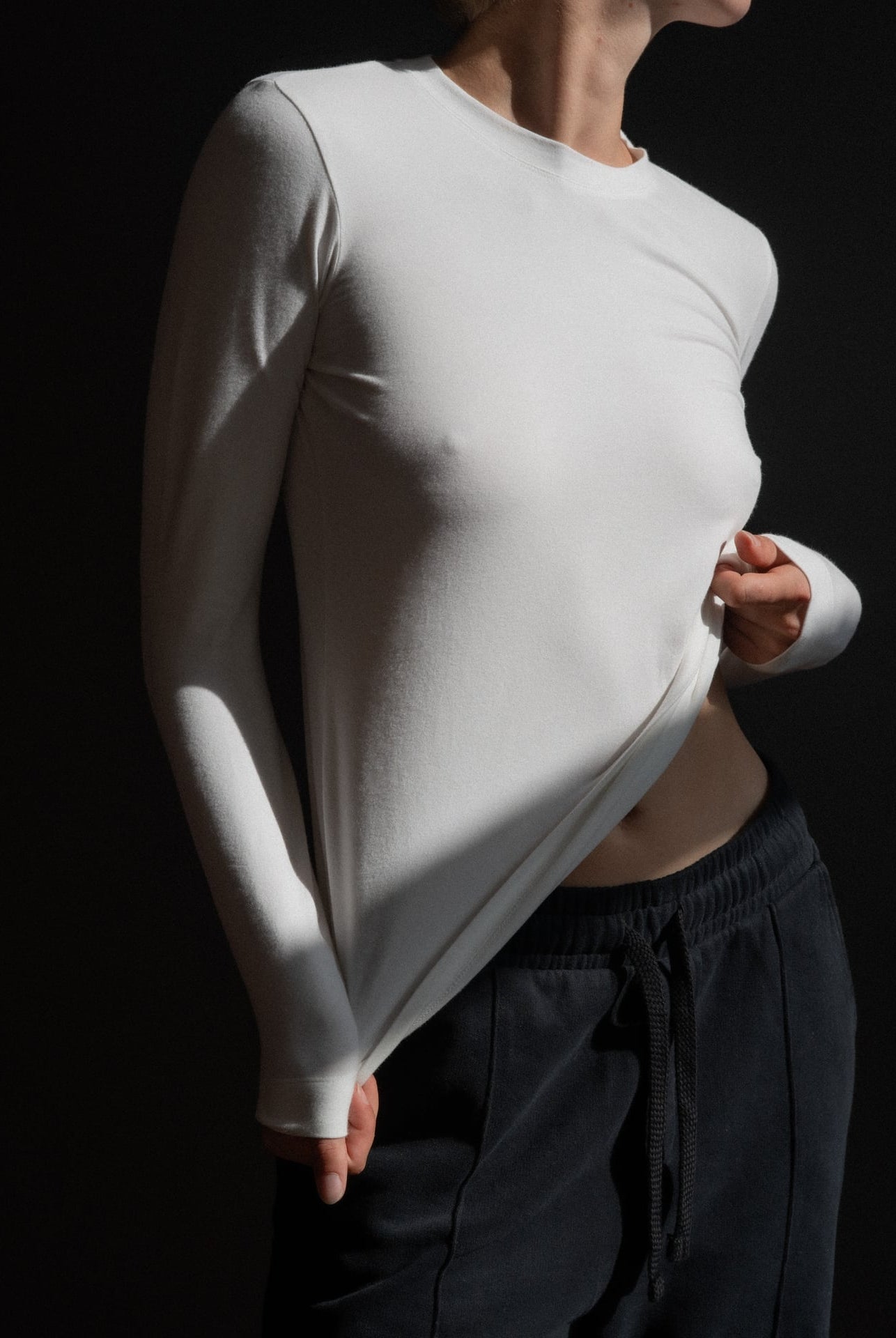 The Nora fitted long sleeve in off-white on model, organic cotton with stretch