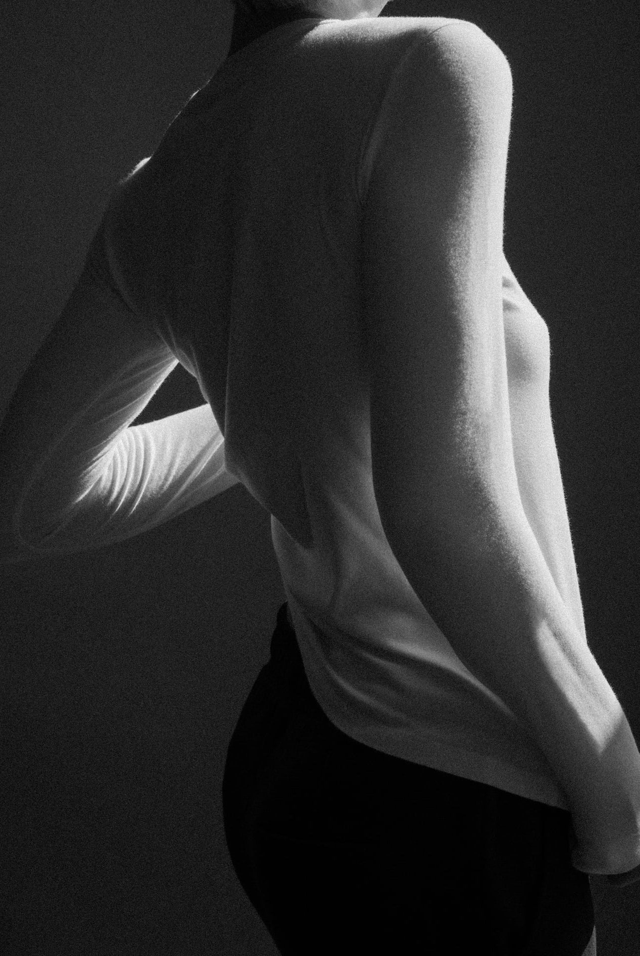 The Nora long sleeve in off-white side view on model, sustainable layering piece