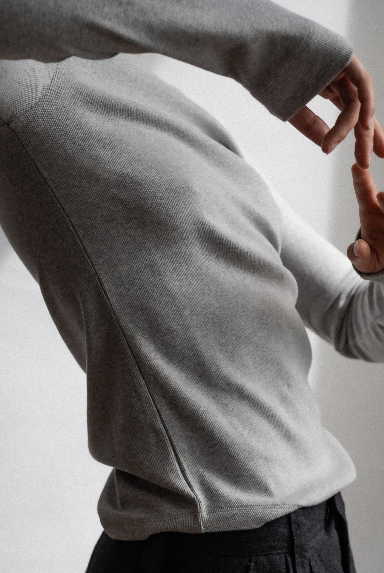 The Ella Grey Melange long sleeve top - side view on model