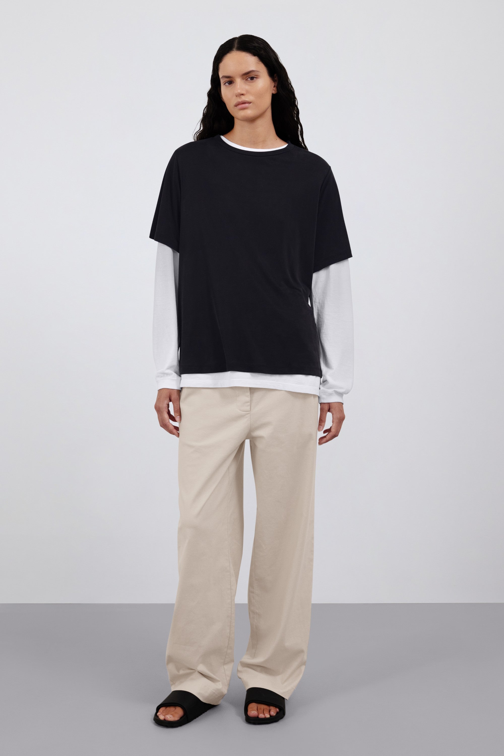 The Sadie in Essential Black. 100% Lyocell. Shown on model with the Emily in Crispy White and The Alex in Beige.