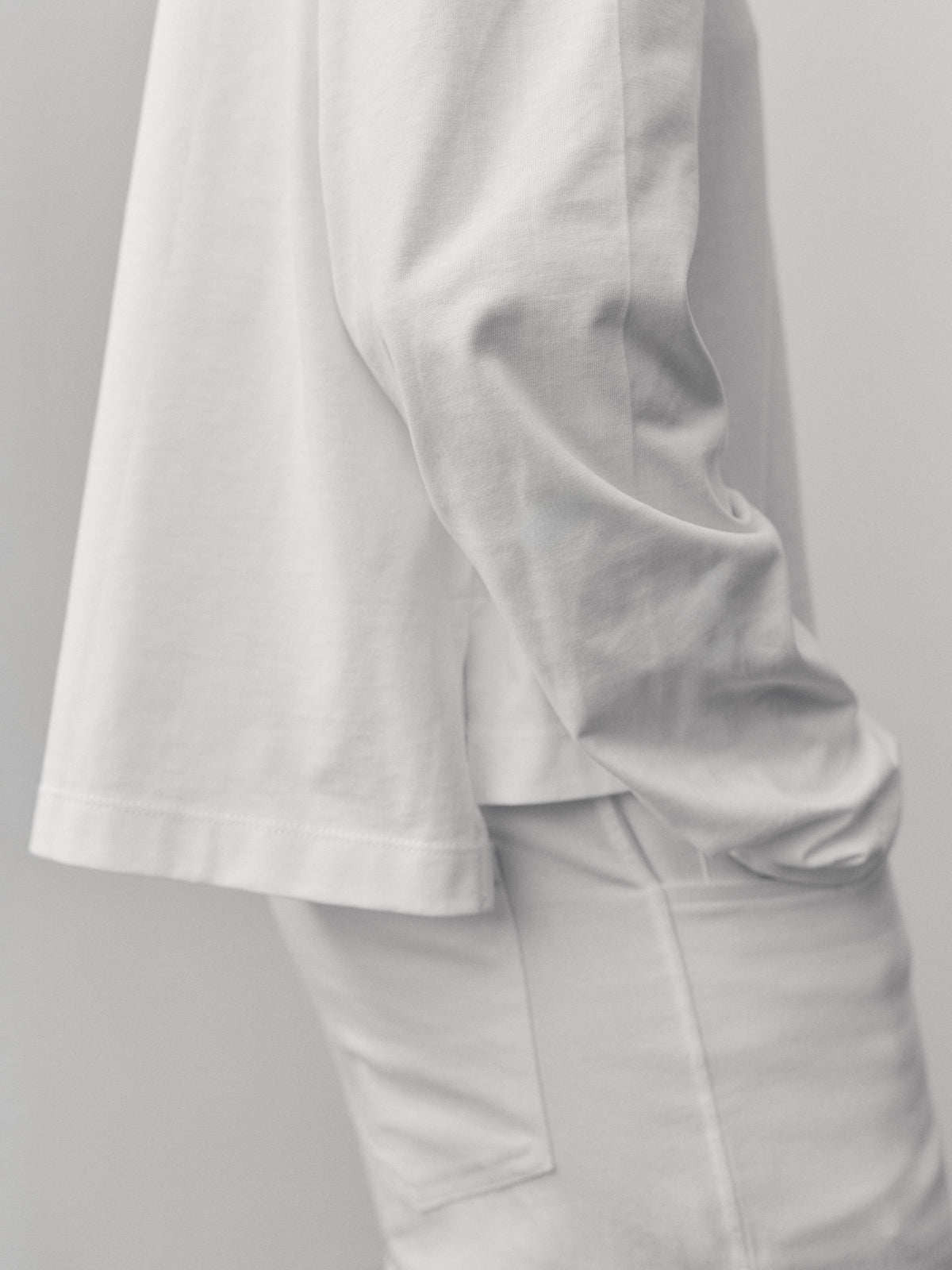 The Charlie in Crispy White. Polo long sleeve, 180 grams. 100% organic cotton. Shown on model.