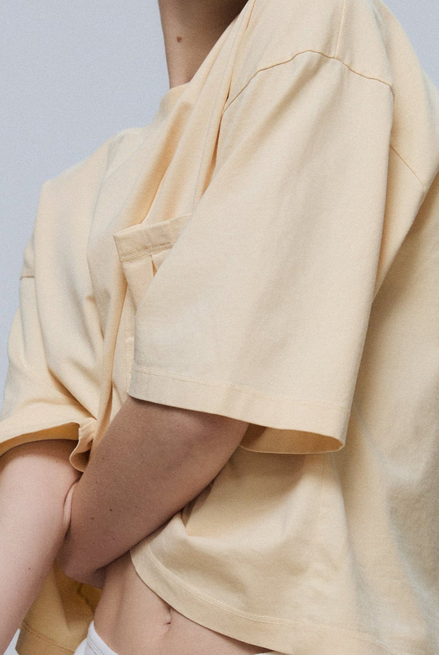 The Tess boxy tee in apricot on model, GOTS certified organic cotton