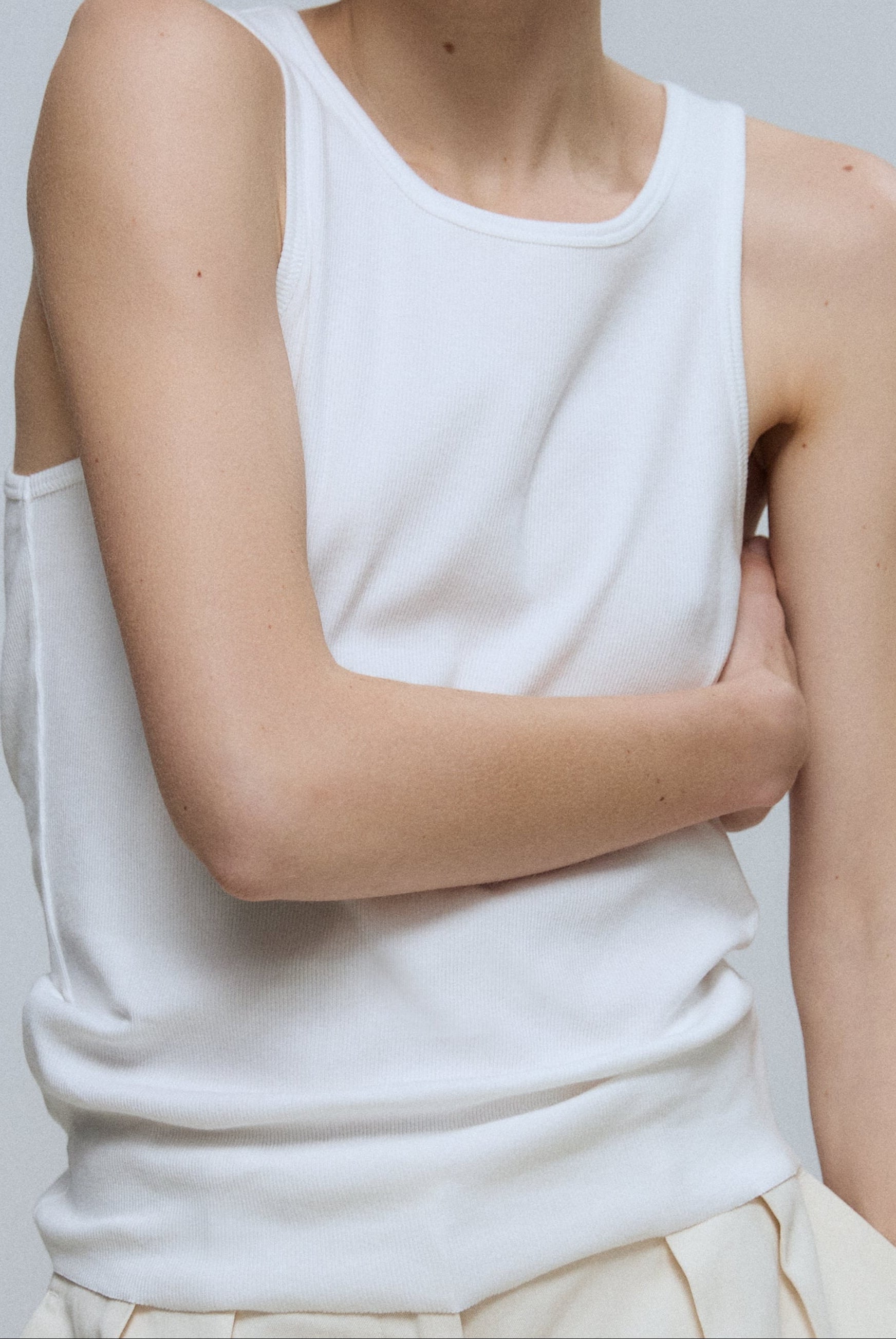 The Kate tank top in off-white on model, GOTS certified organic cotton