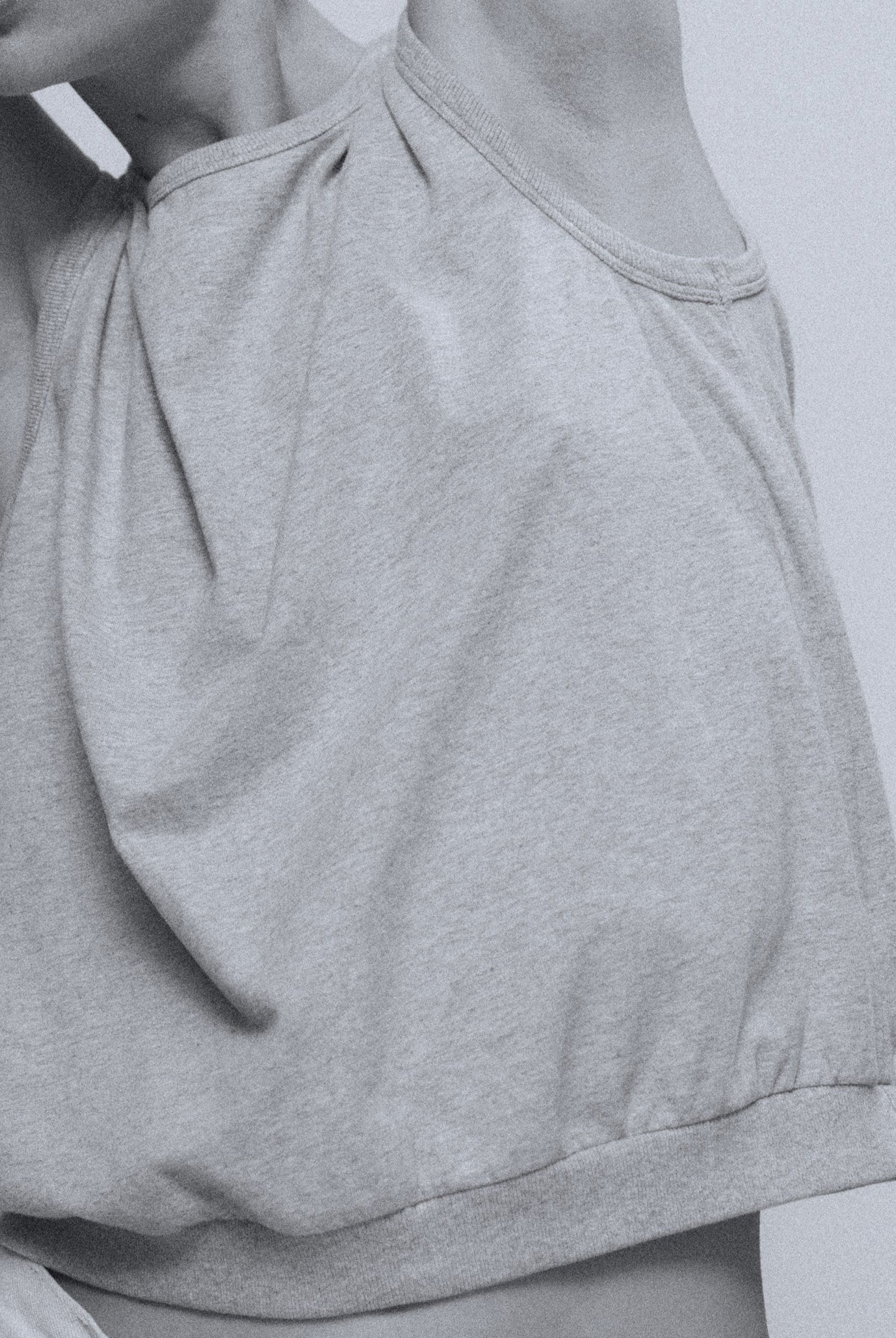 The Noémi tank top in grey melange on model, GOTS certified organic cotton
