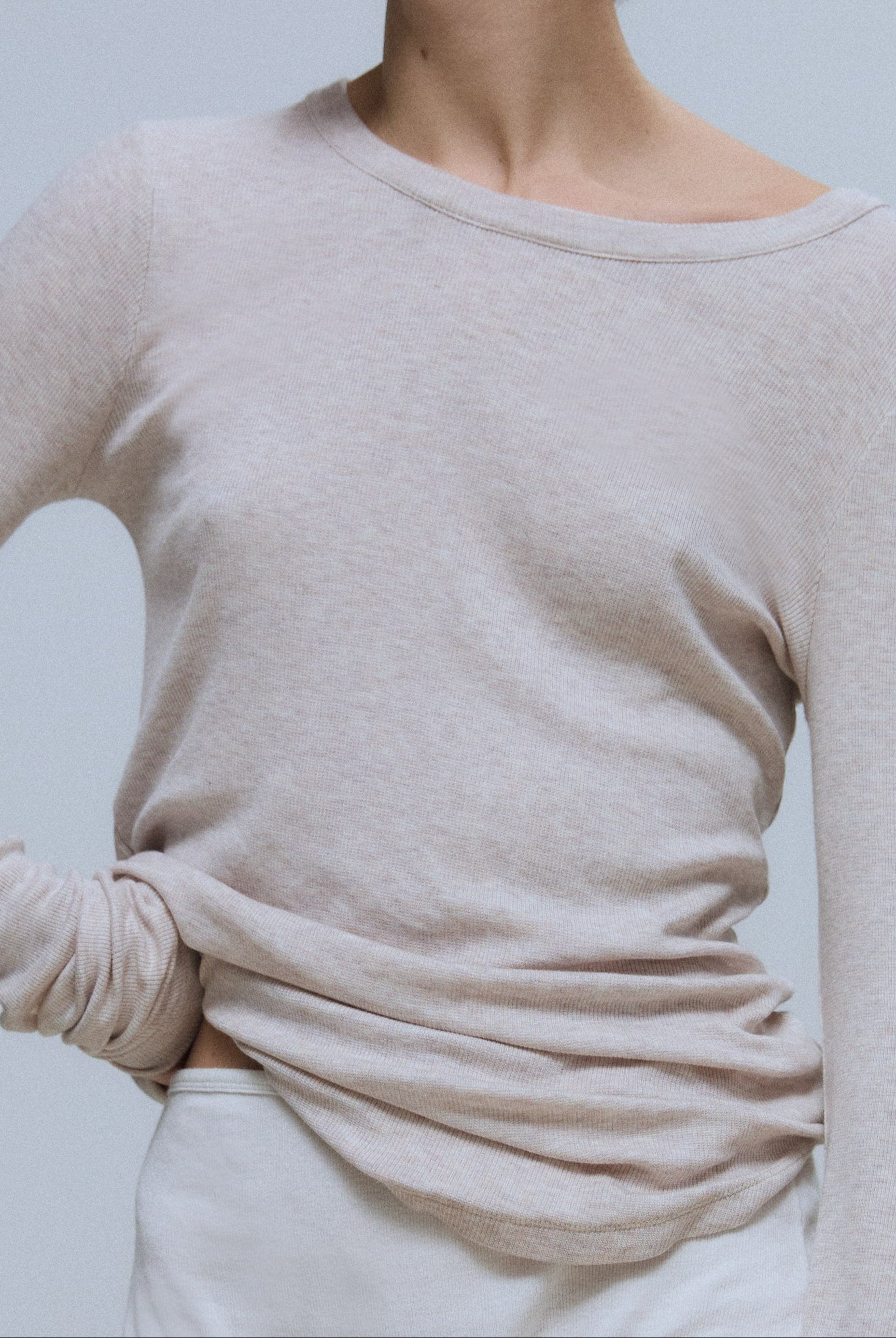 The Georgia beige melange on model, weightless fitted silhouette