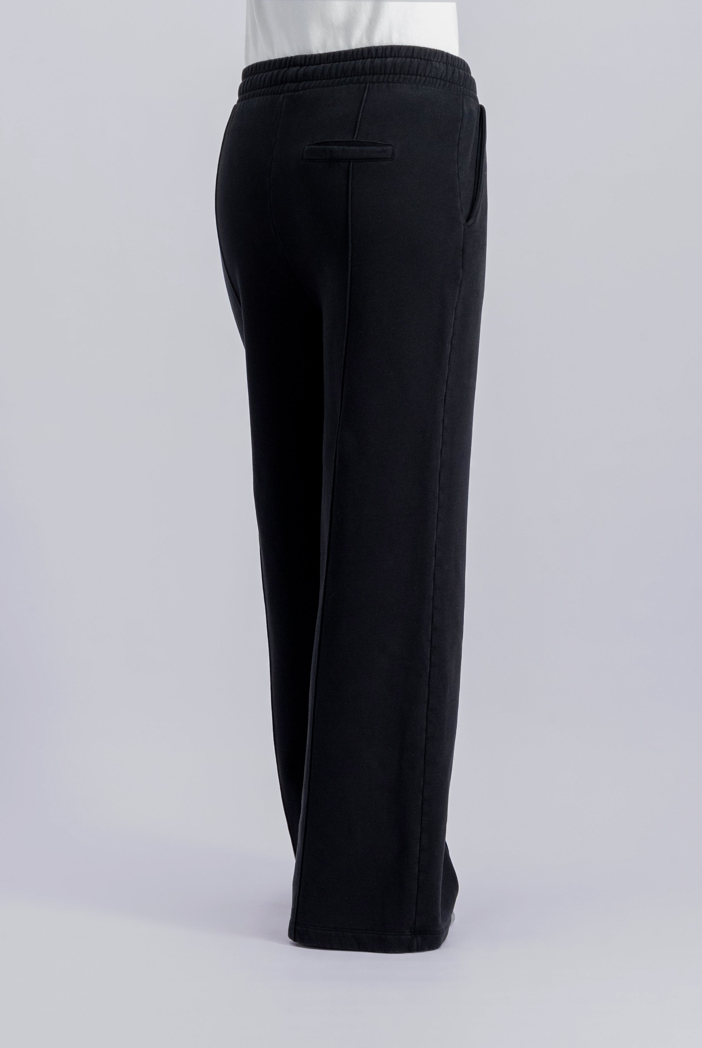 The Gioia essential black sweatpants side view on model, brushed organic cotton