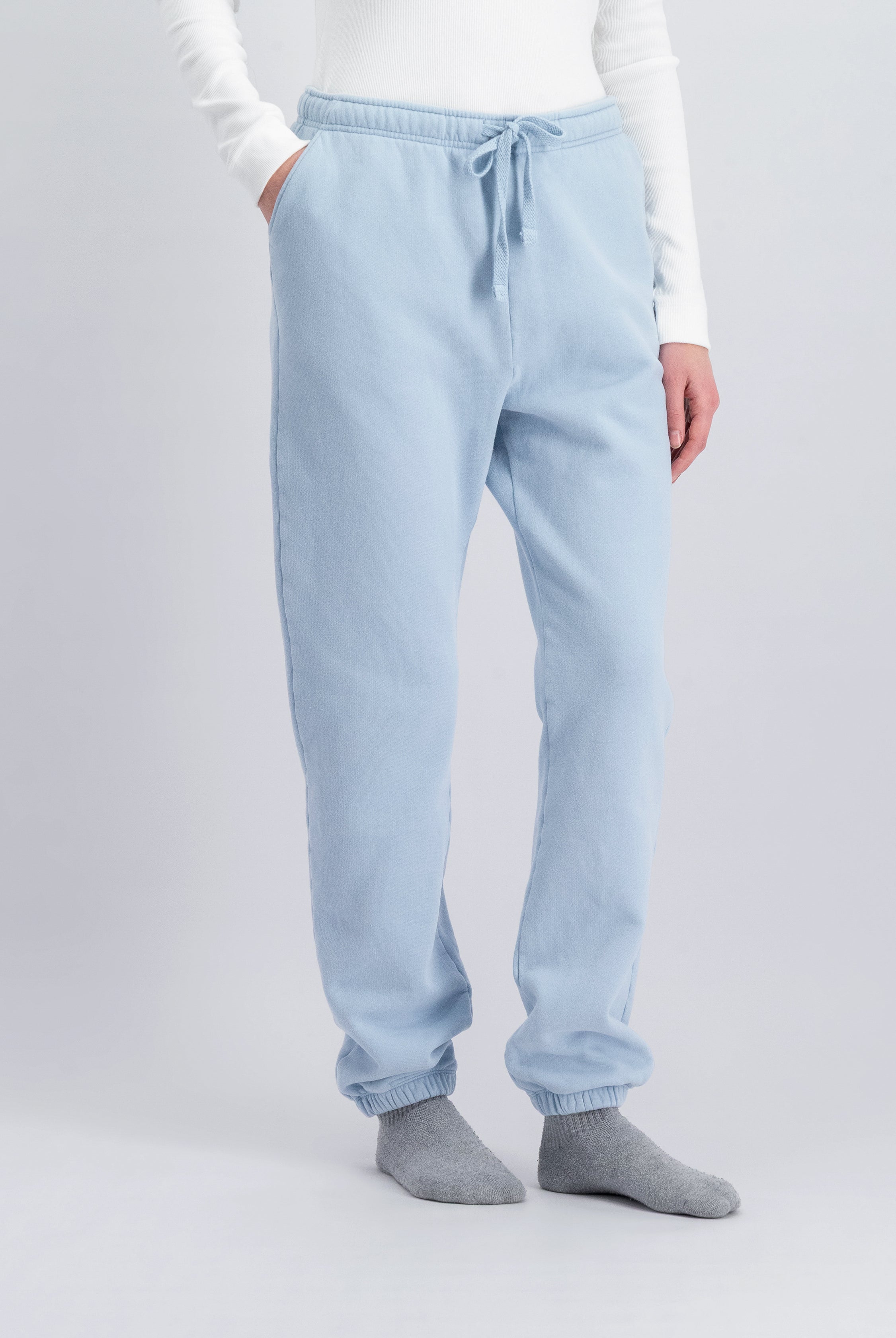 The Abby tapered sweatpants in blue fog on model, organic cotton fleece