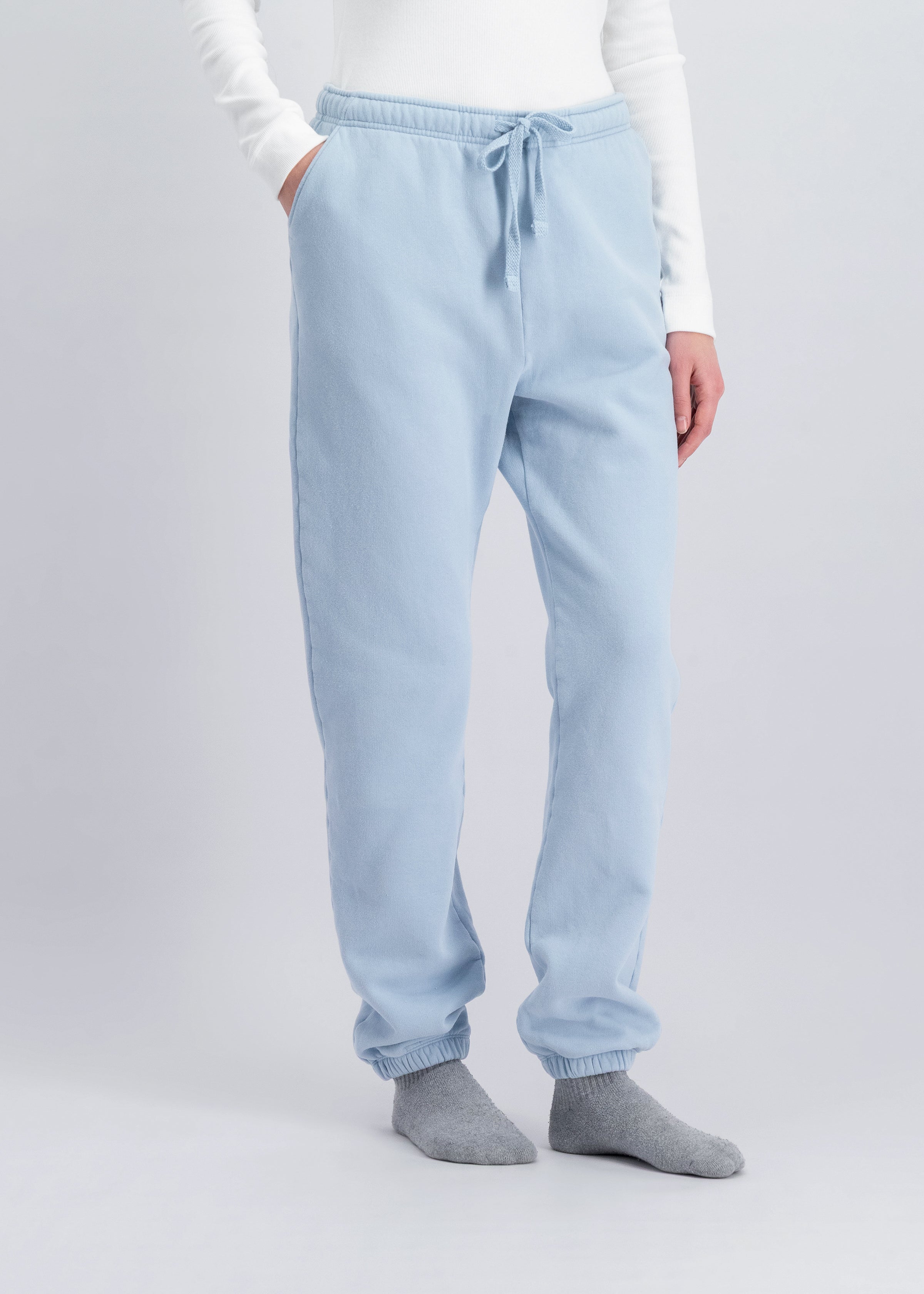 The Abby tapered sweatpants in blue fog on model, organic cotton fleece