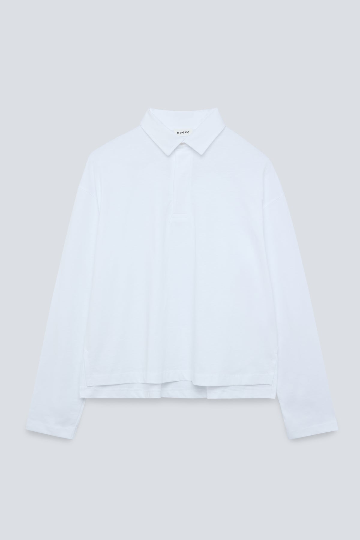 The Charlie in Crispy White. Polo long sleeve, 180 grams. 100% organic cotton. Front view.