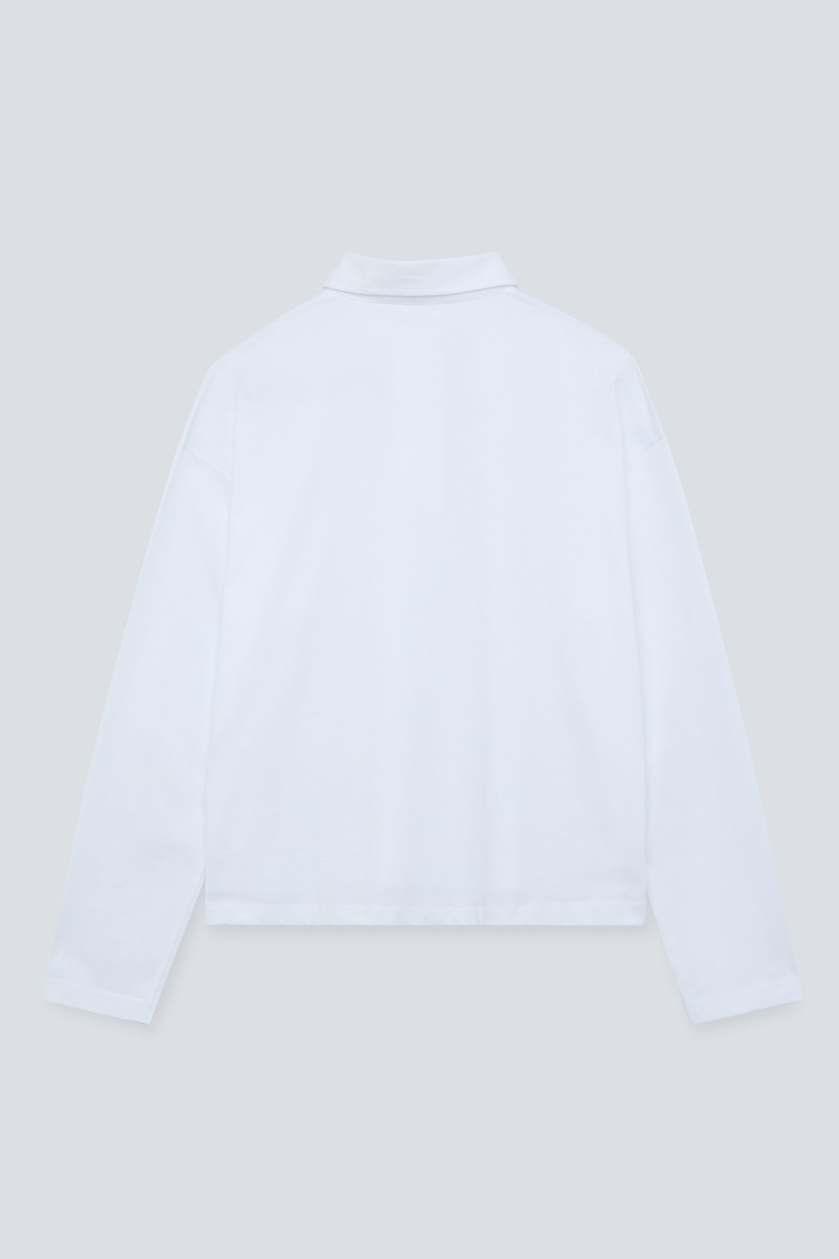 The Charlie in Crispy White. Polo long sleeve, 180 grams. 100% organic cotton. Back view.
