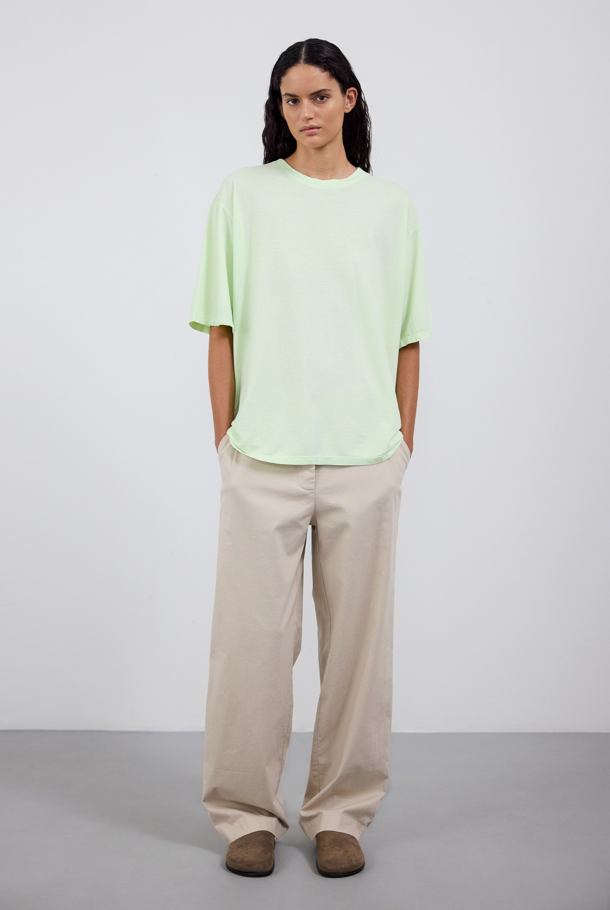 The Lara in Lime shown on model with The Alex pants in beige.
