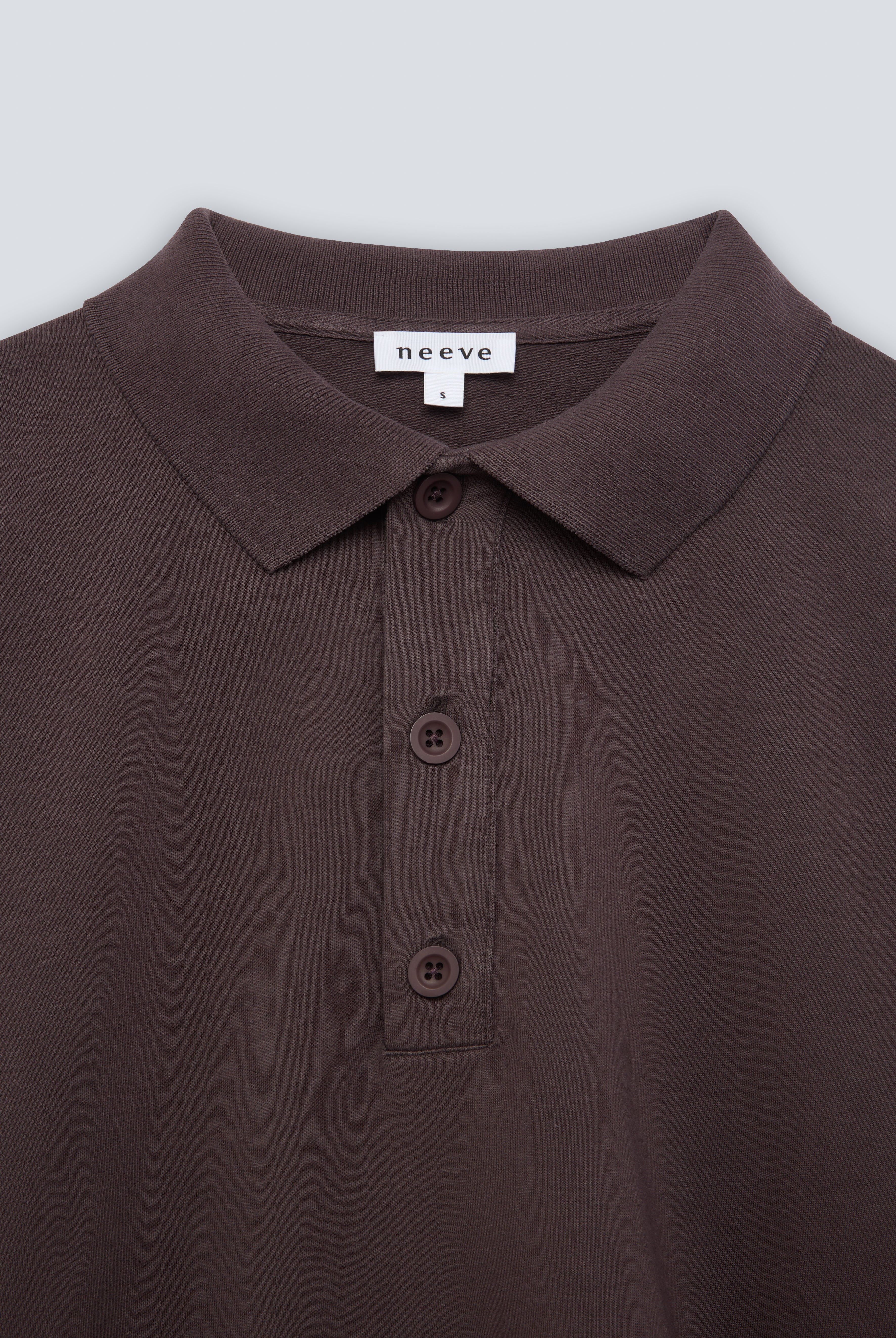 The Remi in Plum. Polo long sleeve and a boxy shape. Made from 100% organic cotton babyfleece. GOTS. Collar detail.