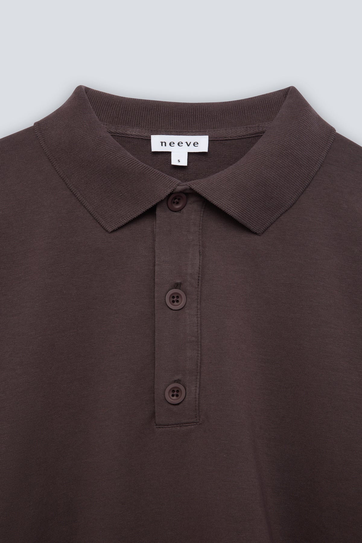 The Remi in Plum. Polo long sleeve with a boxy shape. Made from 100% organic cotton babyfleece. Collar detail.
