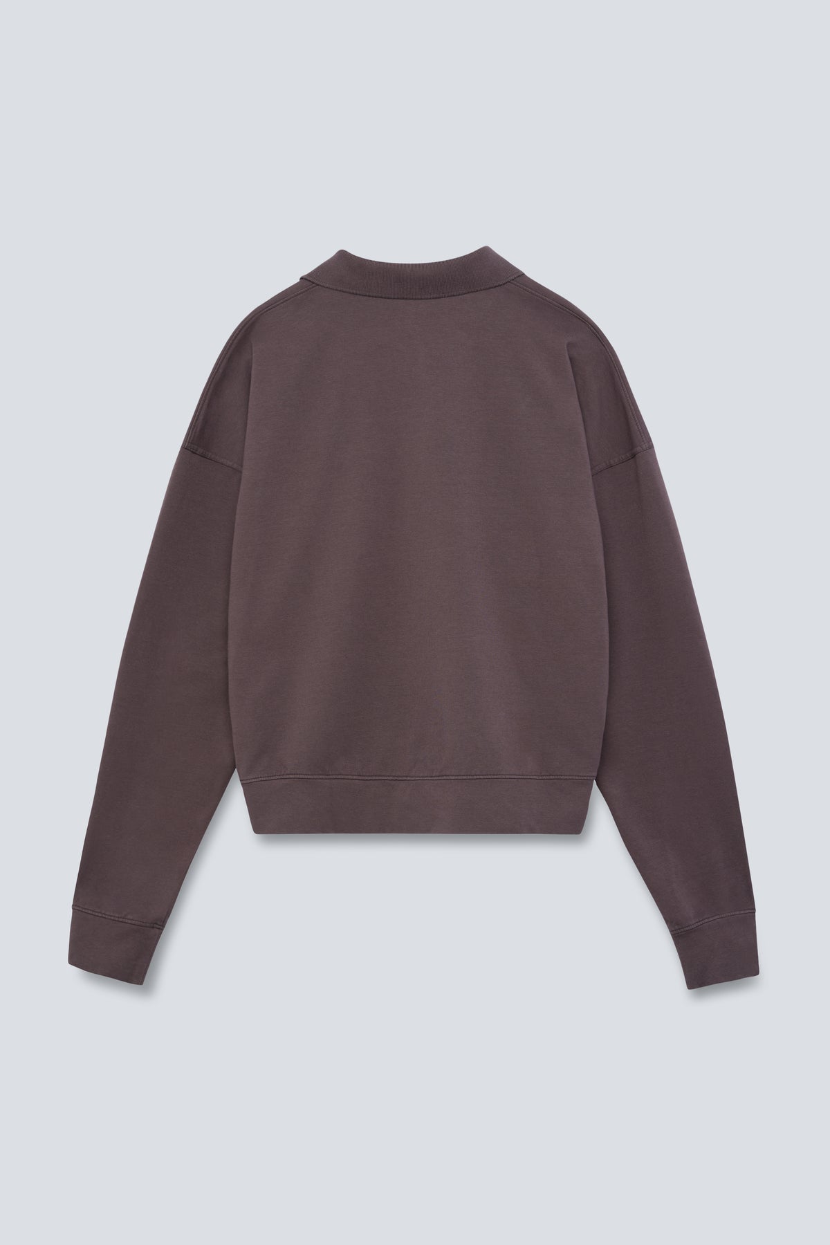 The Remi in Plum. Polo long sleeve with a boxy shape. Made from 100% organic cotton babyfleece. Back view.