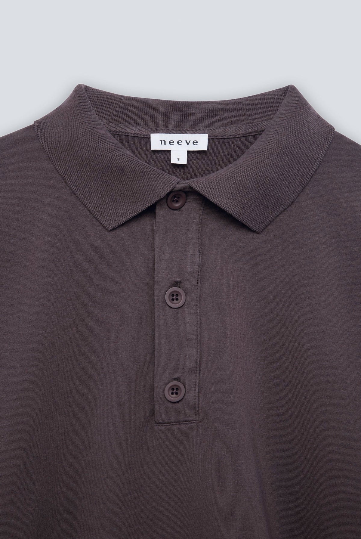 The Remi in Plum. Polo long sleeve with a boxy shape. Made from 100% organic cotton babyfleece. Collar detail.