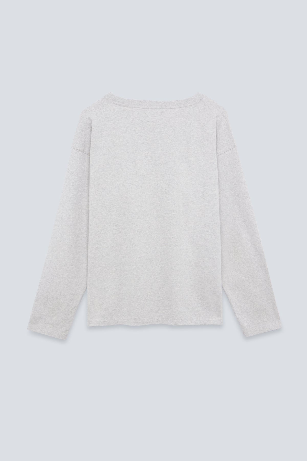The Rose in Grey Melange. An oversized long sleeve that wears like a sweater, but lighter. 95% organic cotton with 5% elastane. Back view.