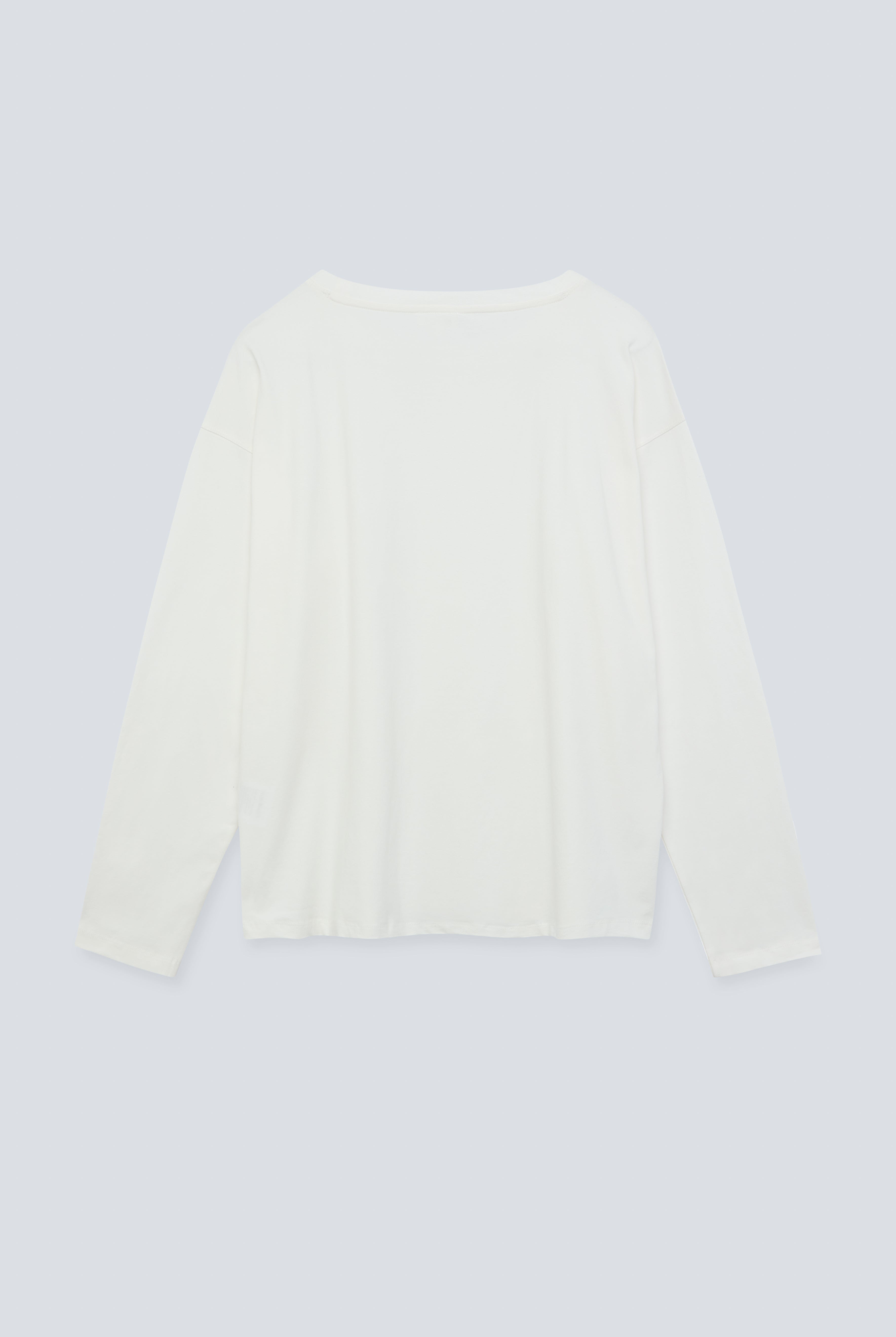 The Rose in Off-White. An oversized long sleeve that wears like a sweater, but lighter. 95% organic cotton with 5% elastane. GOTS. Back view.