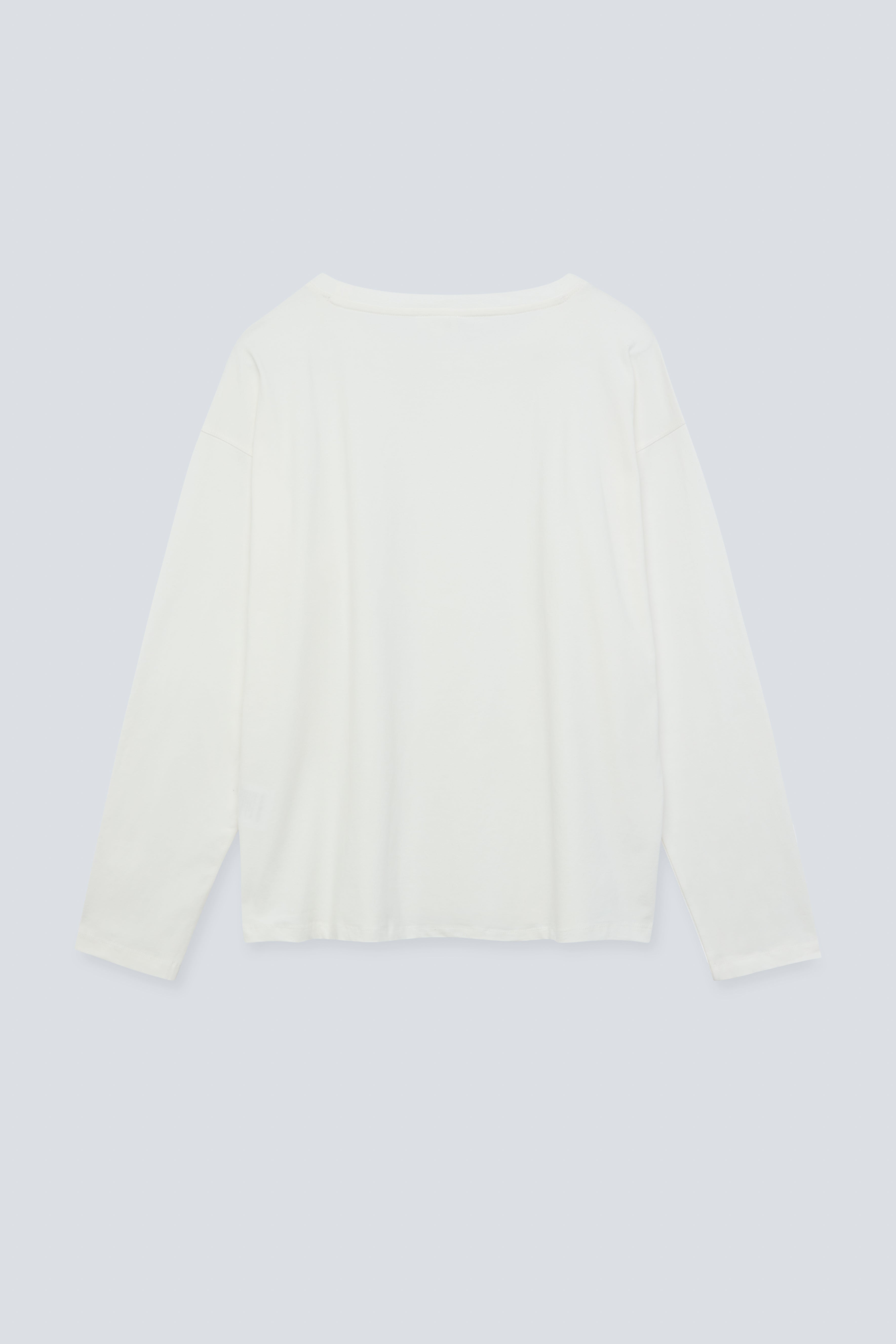 The Rose in Off-White. An oversized long sleeve that wears like a sweater, but lighter. 95% organic cotton with 5% elastane. GOTS. Back view.