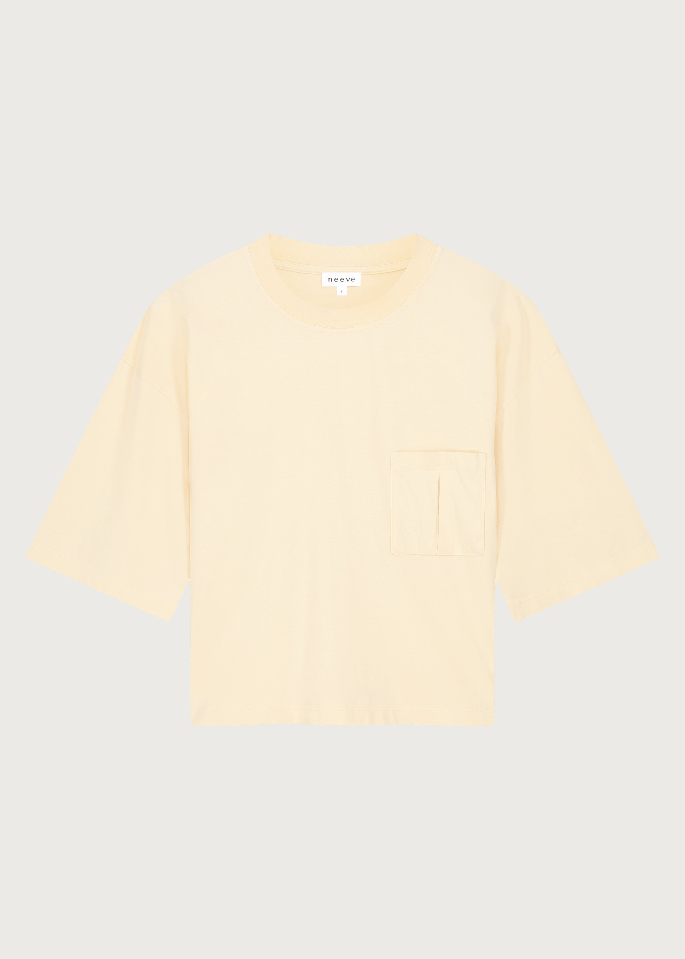 The Tess dropped shoulder tee in apricot front view, pocket detail, 180g organic cotton made in Portugal