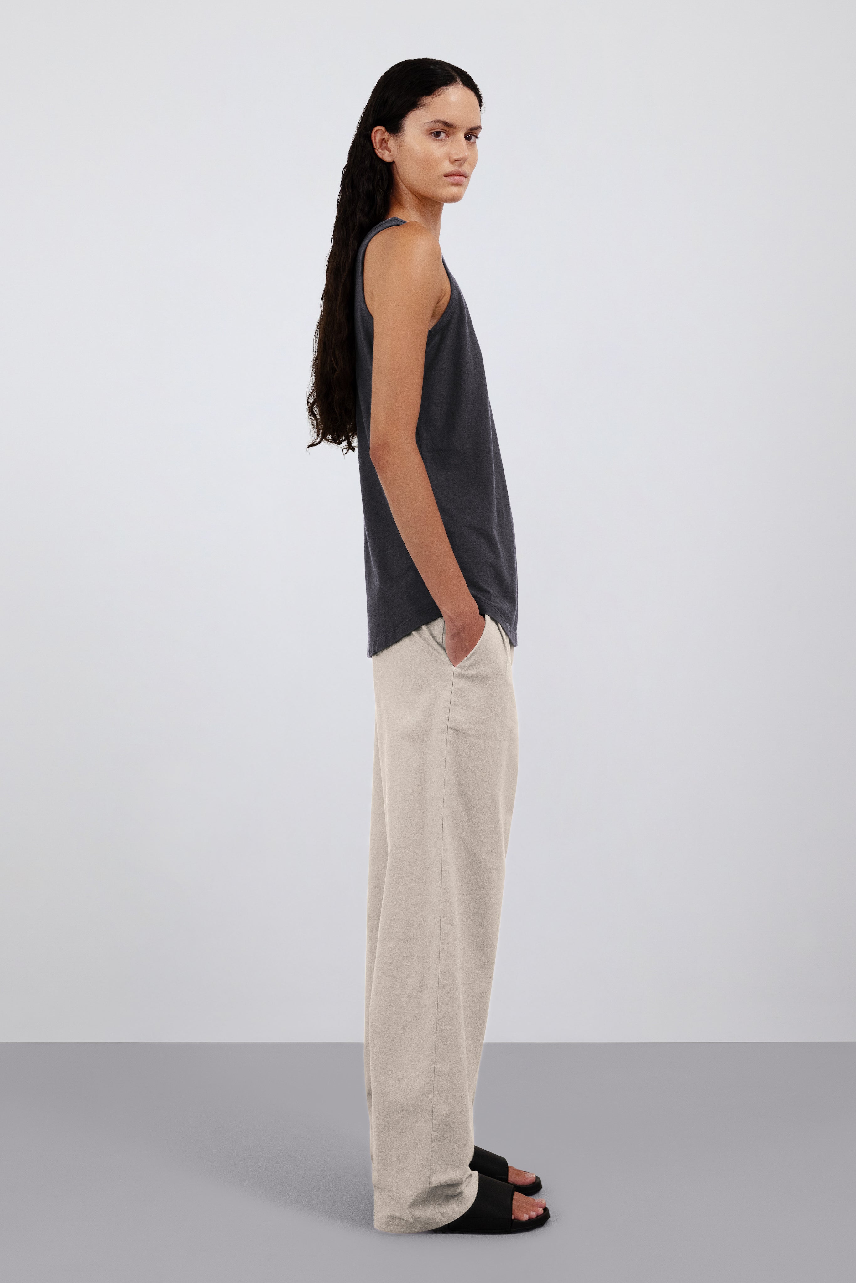 The Selene in Pitch Black. Shown on model. 140 grams organic cotton. GOTS certified. Shown with the Alex in Beige.