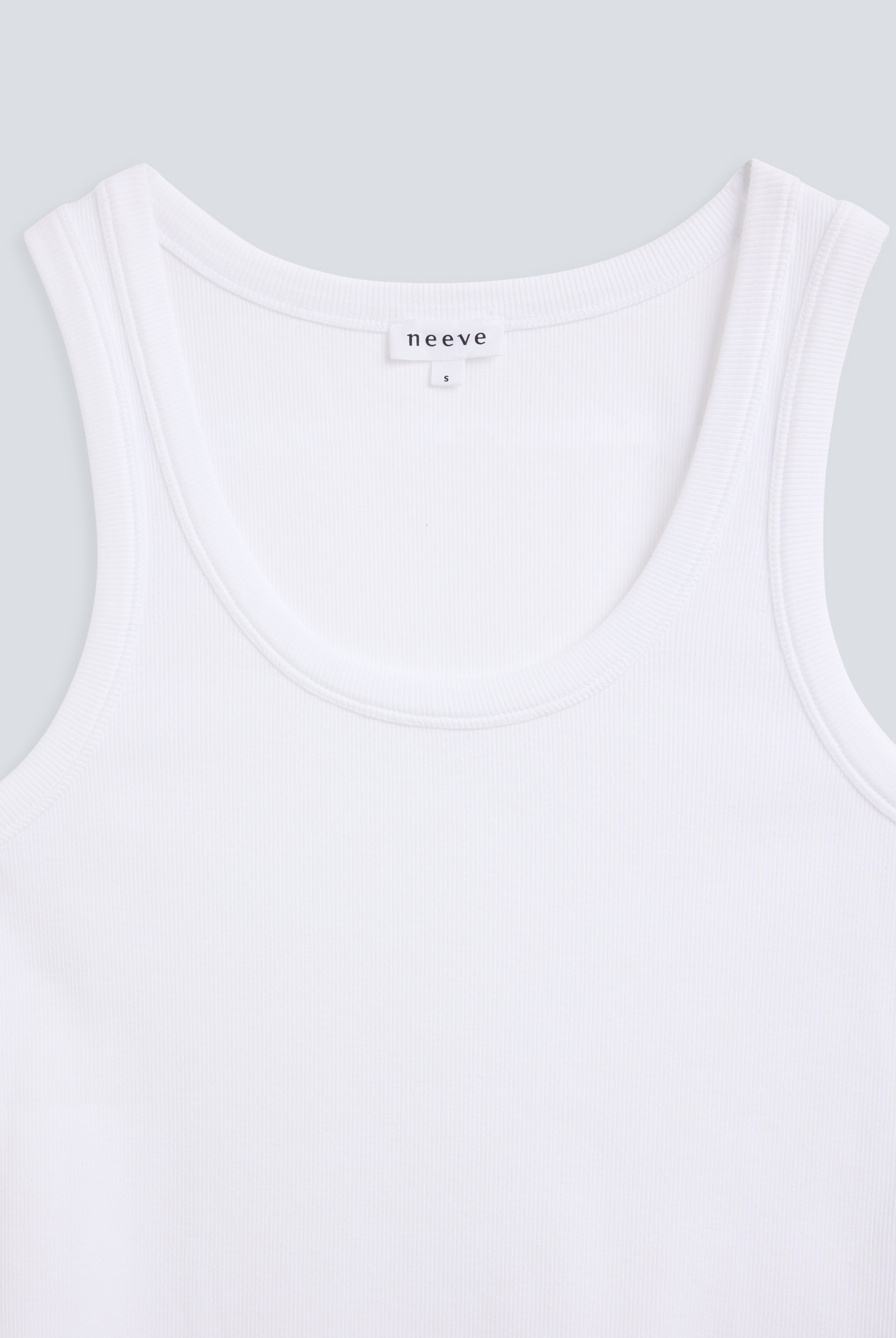The Josie organic cotton tank top in crispy white, detail front. GOTS-certified