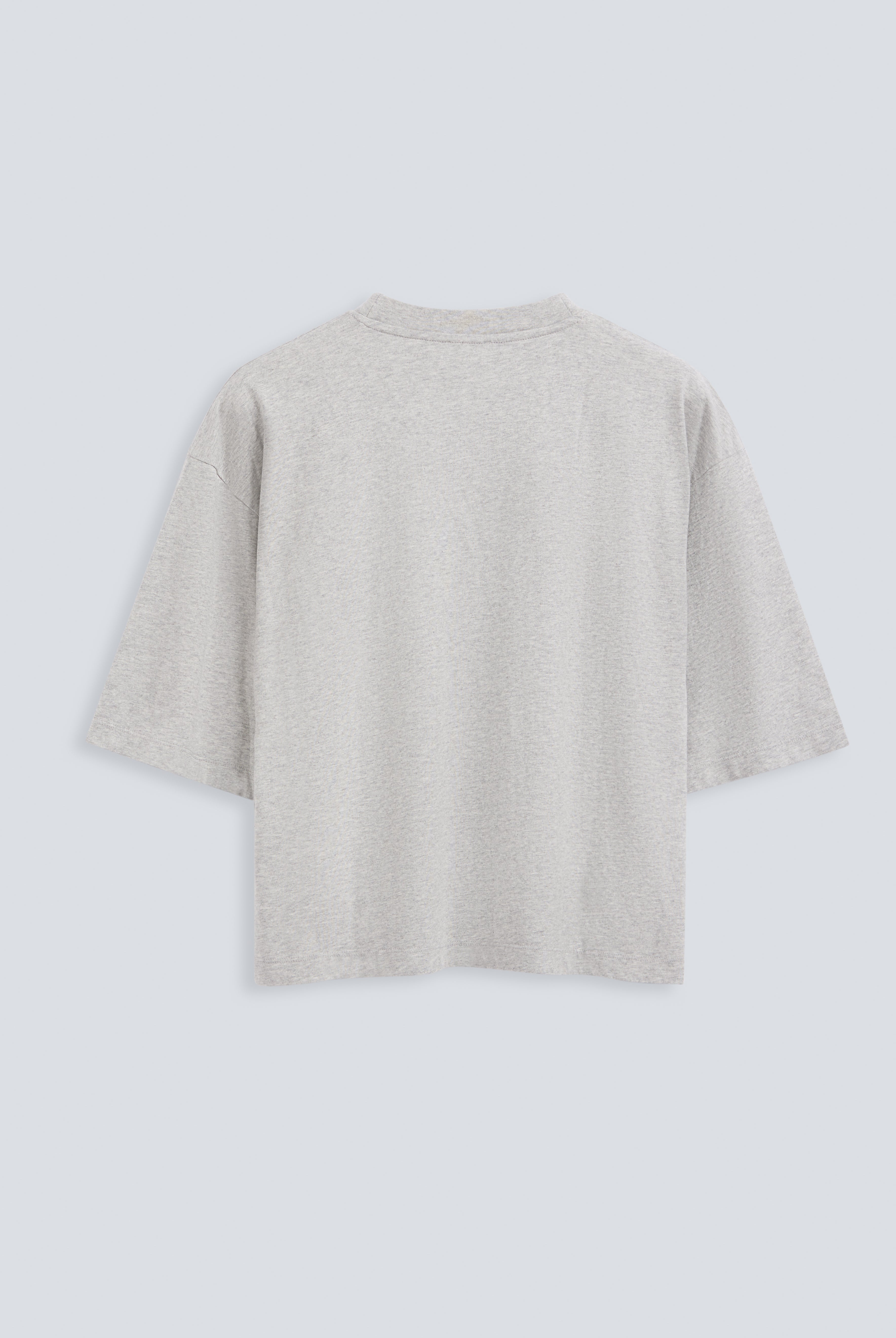 The Talia in Grey Melange. Back view. Dropped shoulders and mid-length sleeves, 180g, 100% organic cotton made in Portugal. GOTS