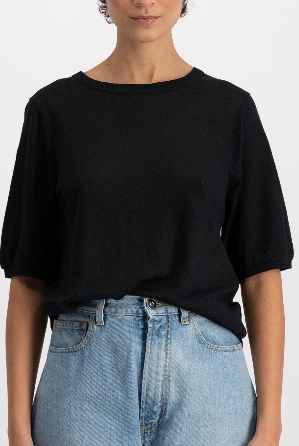 The Billie linen top in essential black on model, mid-sleeve crew neck, 100% linen made in Portugal