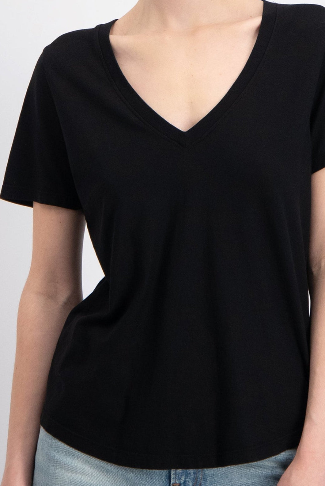 The Stella v-neck t-shirt in essential black, shown on model, GOTS certified organic cotton