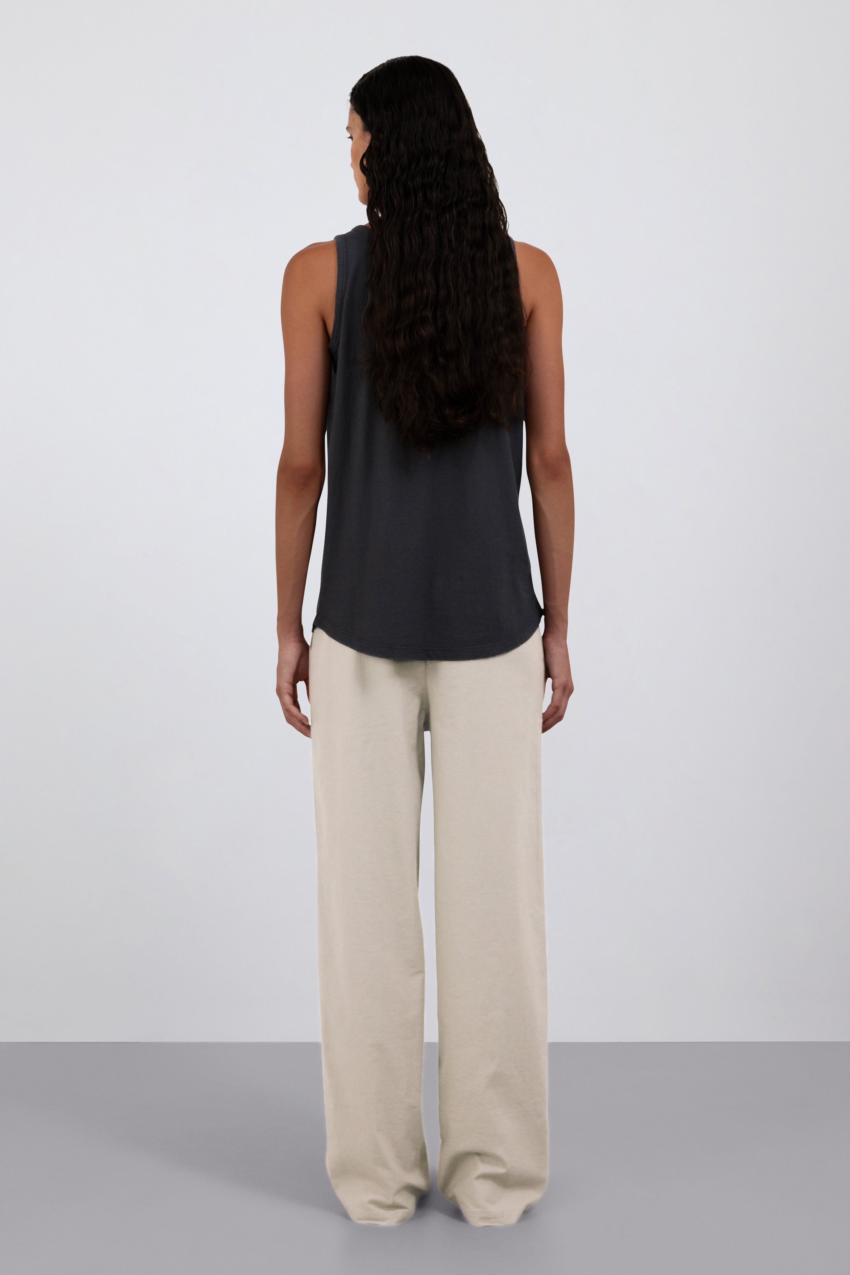 Back view. Shown on model. The Selene in Pitch Black. The Alex in Beige. 