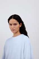 The Emily in Ice Blue shown on model. 140 grams organic cotton. GOTS certified. 