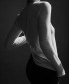 The Nora long sleeve in off-white side view on model, sustainable layering piece