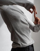 The Ella Grey Melange long sleeve top - side view on model