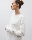 The Rose in Off-White. An oversized long sleeve that wears like a sweater, but lighter. 95% organic cotton with 5% elastane. GOTS. Shown on model. 
