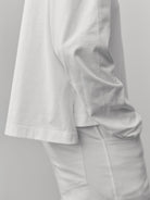 The Charlie in Crispy White. Polo long sleeve, 180 grams. 100% organic cotton. GOTS. Shown on model. 