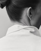 The Charlie in Crispy White. Polo long sleeve, 180 grams. 100% organic cotton. GOTS. Collar detail. Shown on model. 