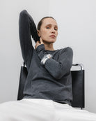 The Nora long sleeve in Anthracite. Made from 95% organic cotton with 5% elastane. Brushed outside. Shown on model view. GOTS