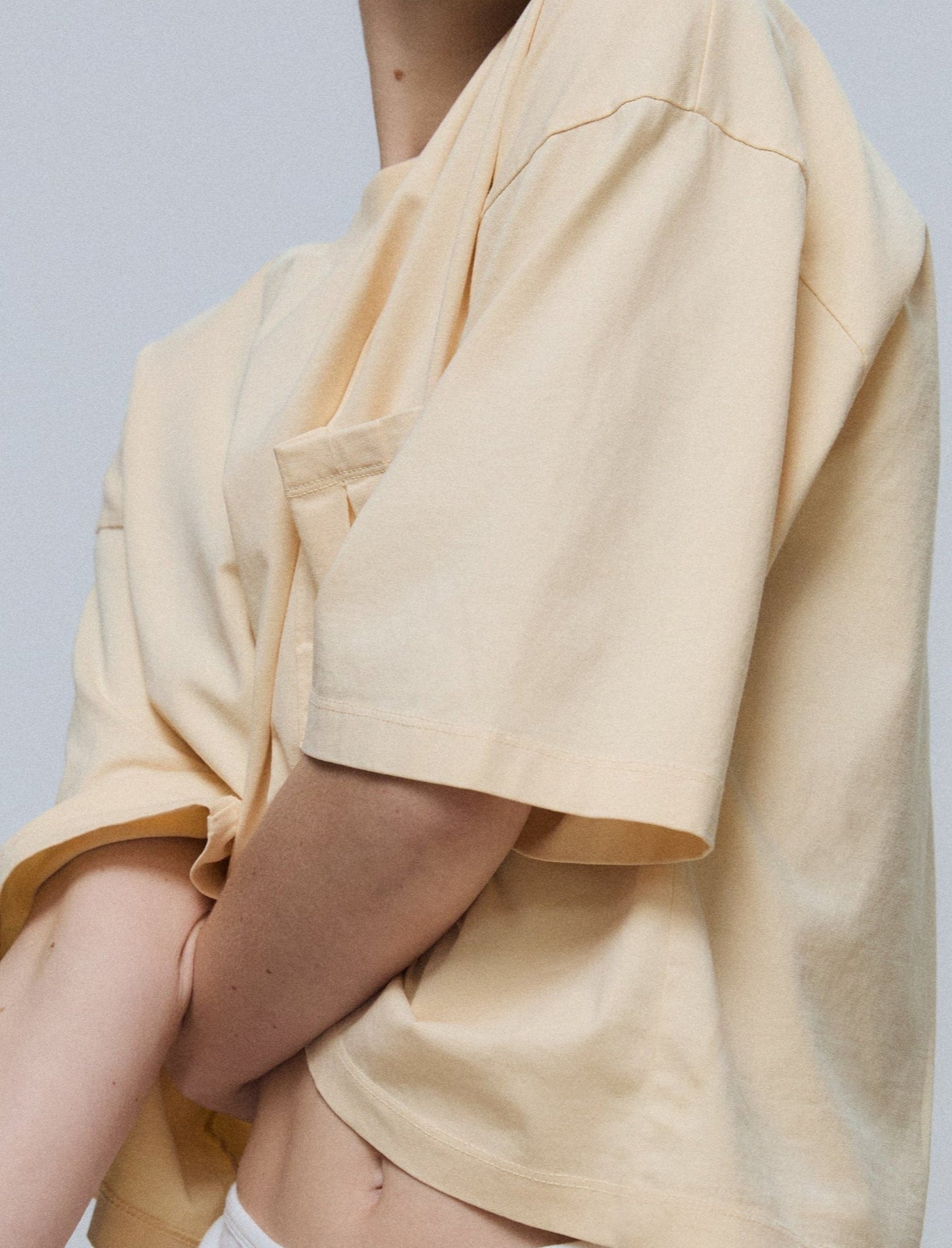 The Tess boxy tee in apricot on model, GOTS certified organic cotton