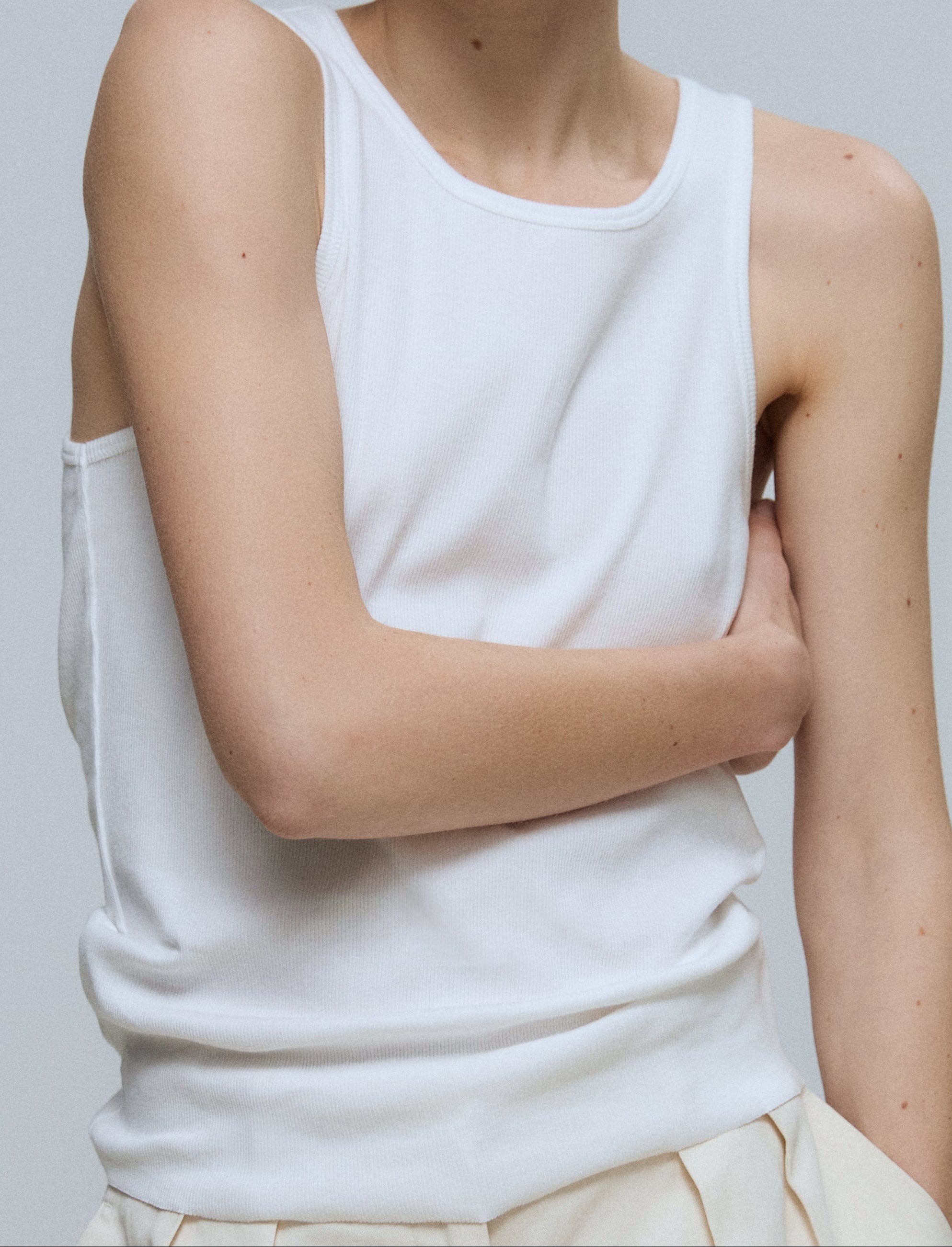 The Kate tank top in off-white on model, GOTS certified organic cotton
