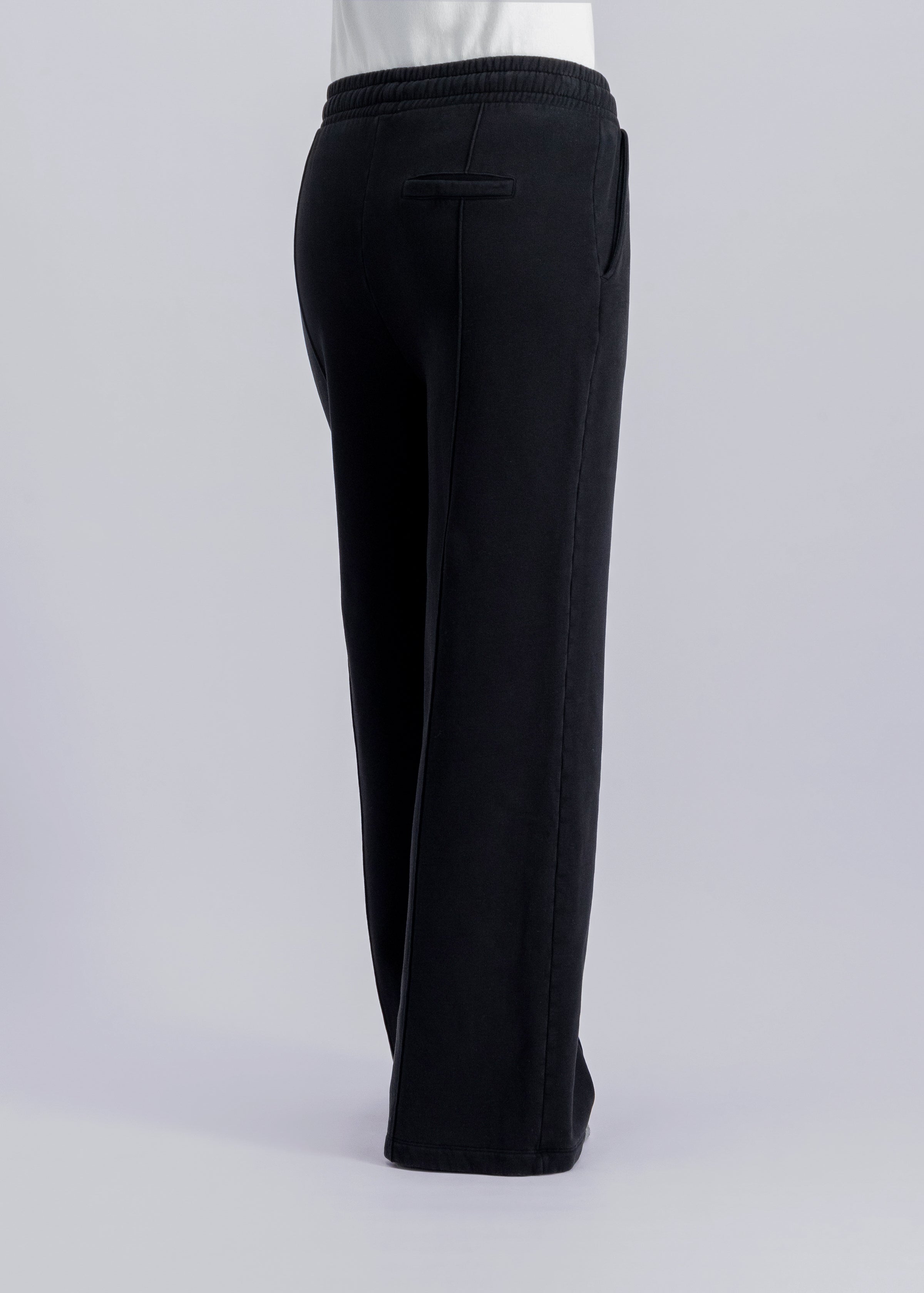 The Gioia essential black sweatpants side view on model, brushed organic cotton