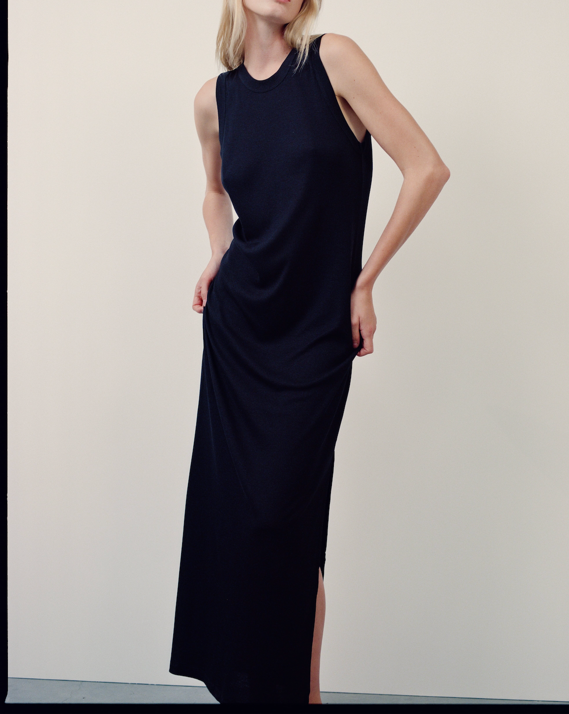 The Leanne dress in essential black on model, 95% organic cotton 5% elastane GOTS certified made in Portugal