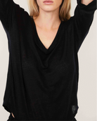 The Iris linen v-neck shirt in essential black on model, 3/4 sleeve sustainable top