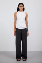 The Riley in Pitch Black. 100% organic cotton babyfleece. GOTS certified. Shown on model. Front view.