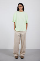 The Lara in Lime shown on model with The Alex pants in beige. 
