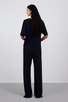 The Mare in Essential Black. 95% Micromodal with 5% elastane. Shown on model with The Sam in Essential Black. Back view. 