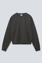 The May in Pitch Black. Crew-neck sweater with a boxy shape. 100% organic cotton babyfleece. GOTS. Front view. 