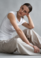 The Mika Crispy White cap sleeve top in crispy white shown on model. Ribbed modal fabric