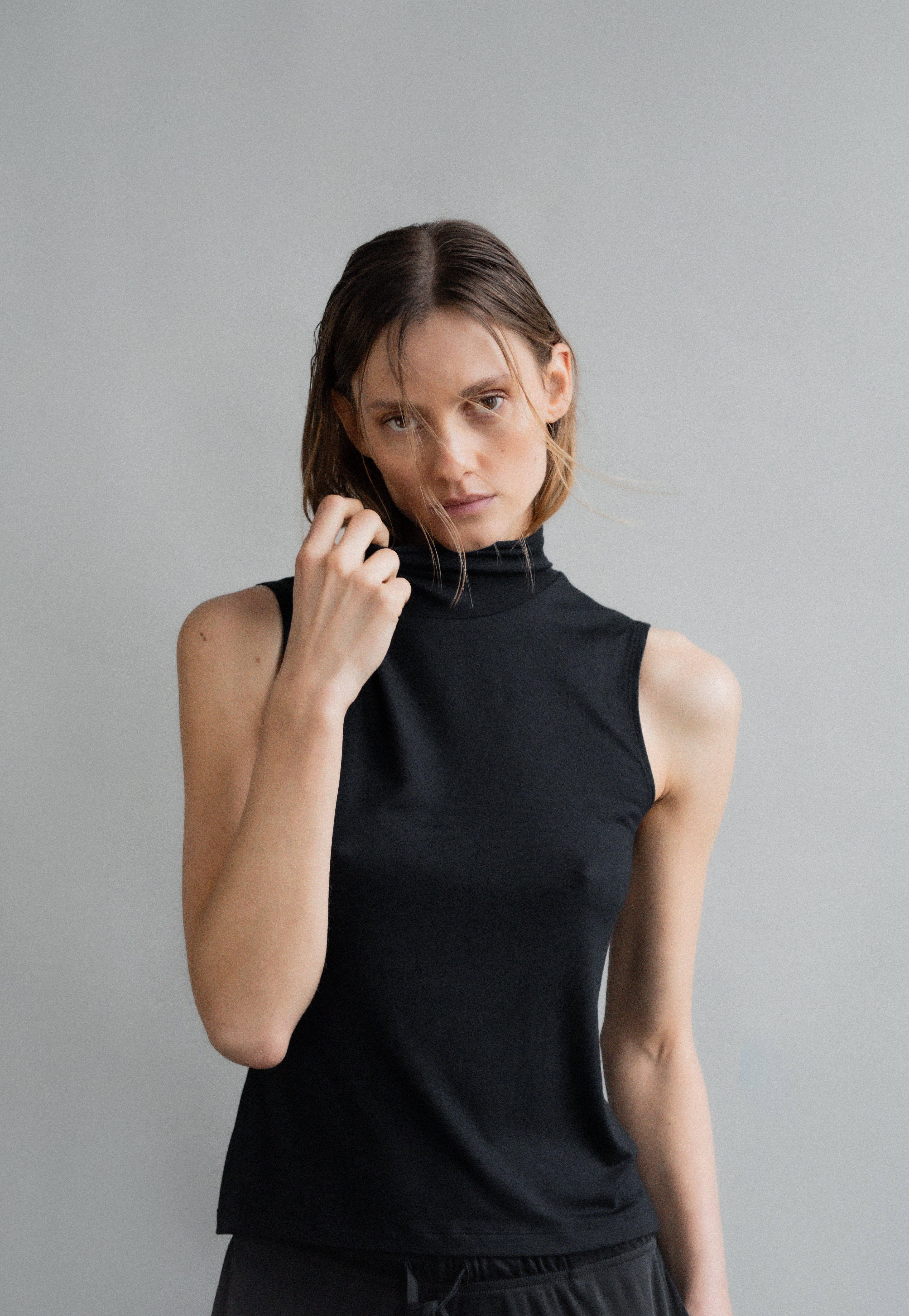 The Mikki in Essential Black. 
95% Micromodal with 5% elastane. Shown on model with The Sam in Essential Black. Front view. 