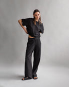 The Noa in Pitch Black shown on model. 180 grams in organic cotton. GOTS certified. Shown here with The Riley in Pitch Black. 