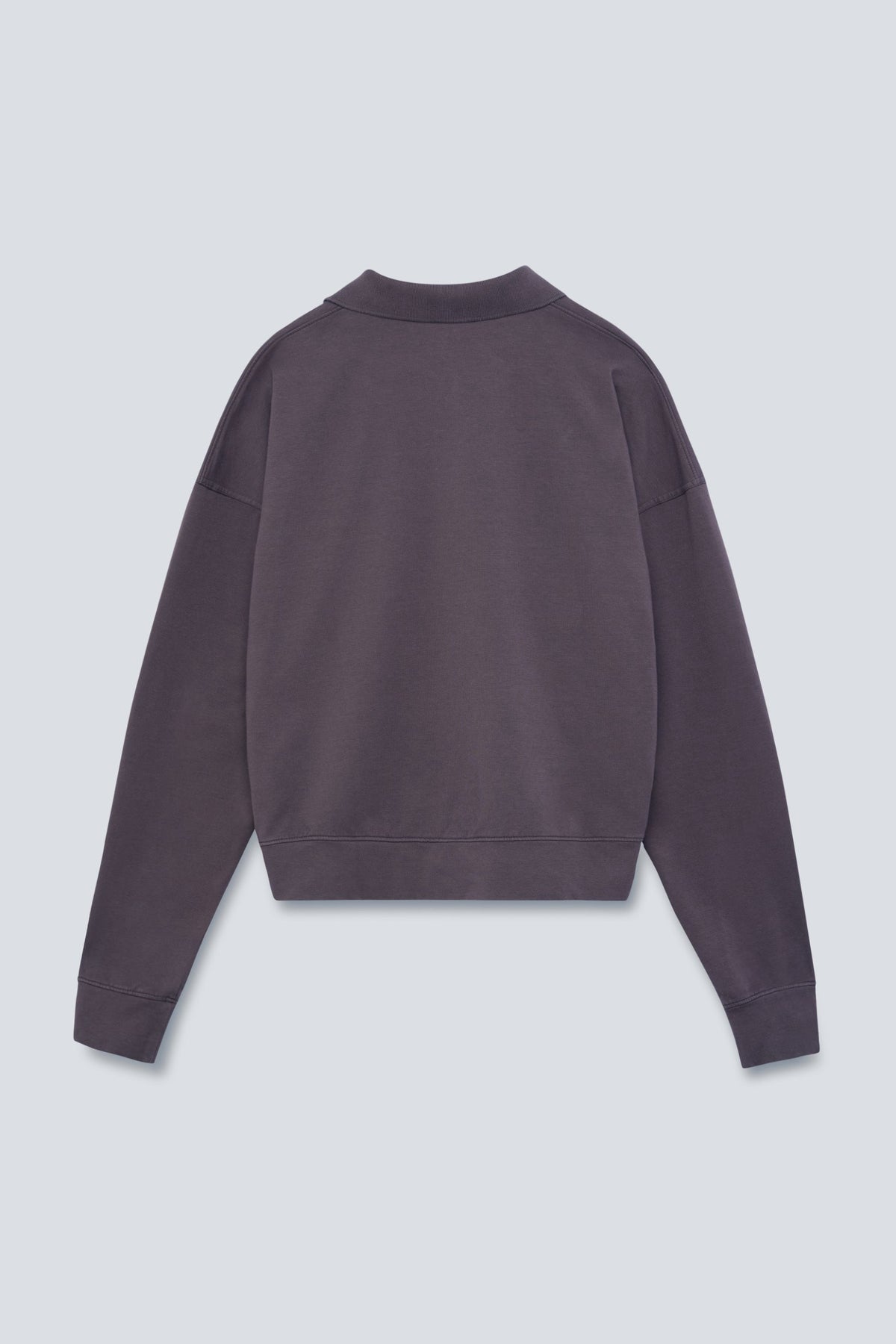 The Remi in Plum. Polo long sleeve with a boxy shape. Made from 100% organic cotton babyfleece. Back view.
